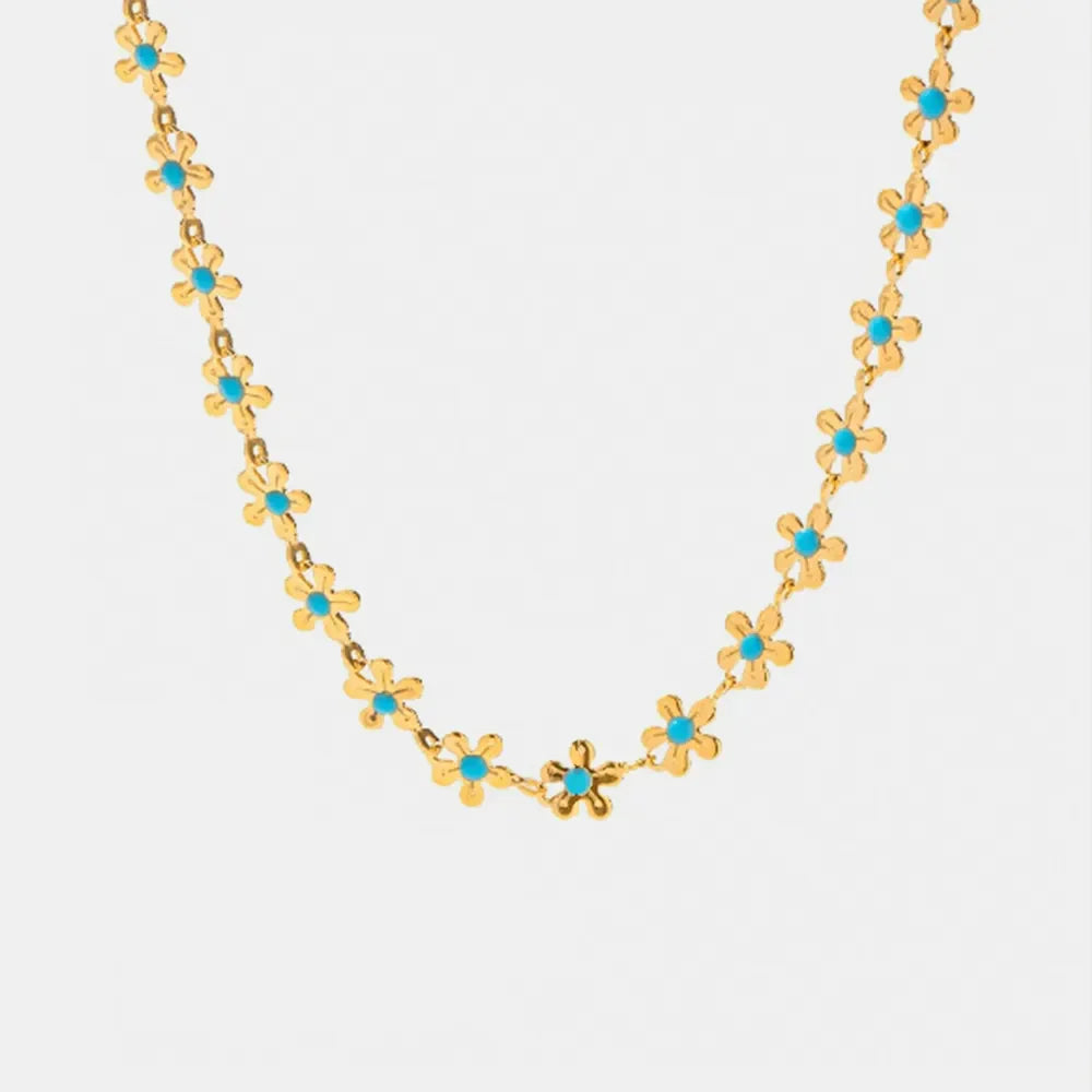 Gold daisy chain enamel petal necklace with turquoise centers
