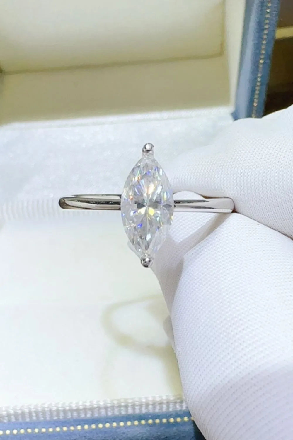 Marquise cut sterling silver solitaire ring with a clear gemstone.