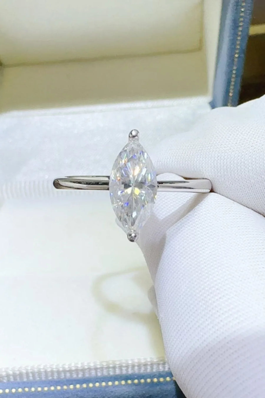 Marquise cut sterling silver solitaire ring with a clear gemstone.