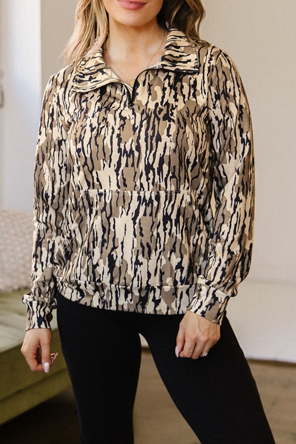 beige sweatshirt featuring pocketed and camo