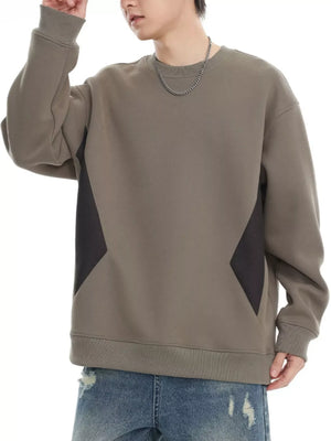 Oversized khaki cotton crew-neck sweatshirt with dark gray panel details.