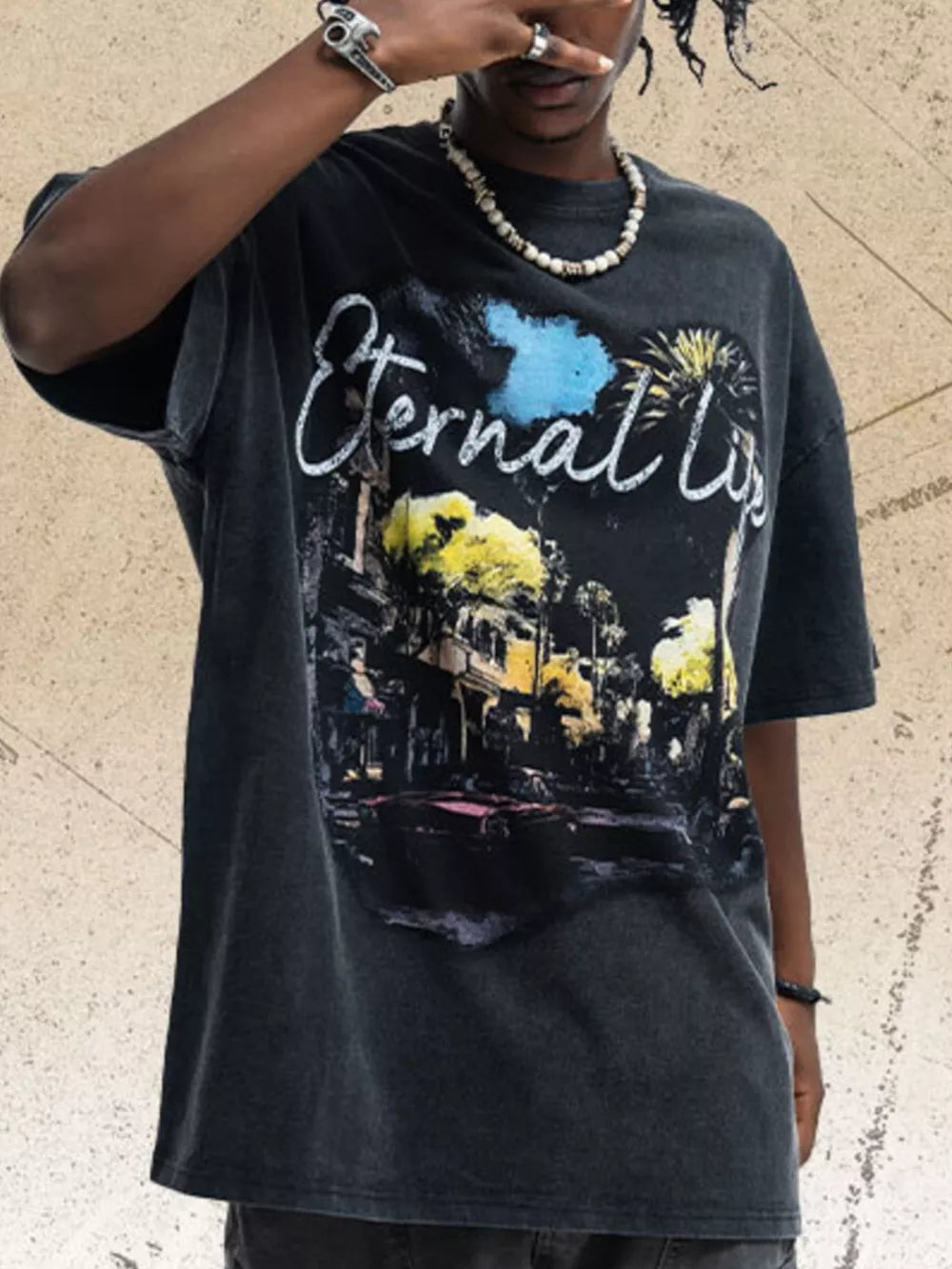 Black cotton graphic tee with "Eternal Life" text and vintage street scene print