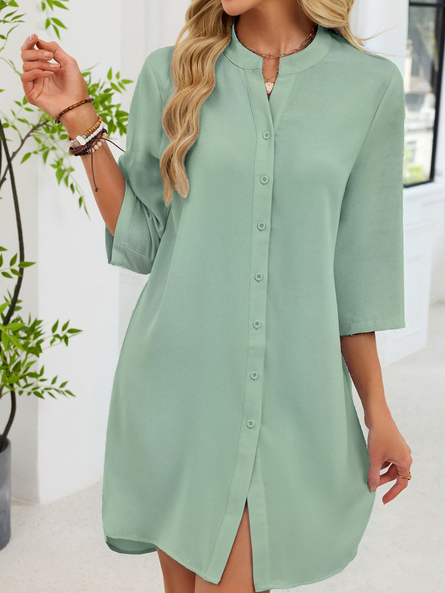 Light green button-down shirt dress with band collar and 3/4 sleeves.