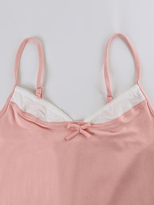Pink cami with lace trim and bow detail, part of a loungewear set.