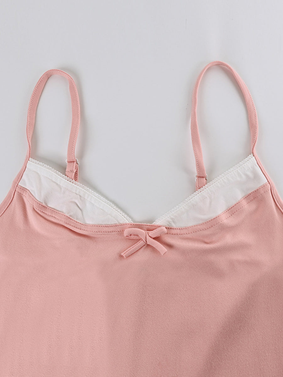 Pink cami with lace trim and bow detail, part of a loungewear set.
