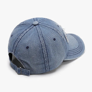 Distressed denim baseball cap in light blue with adjustable strap and frayed details.