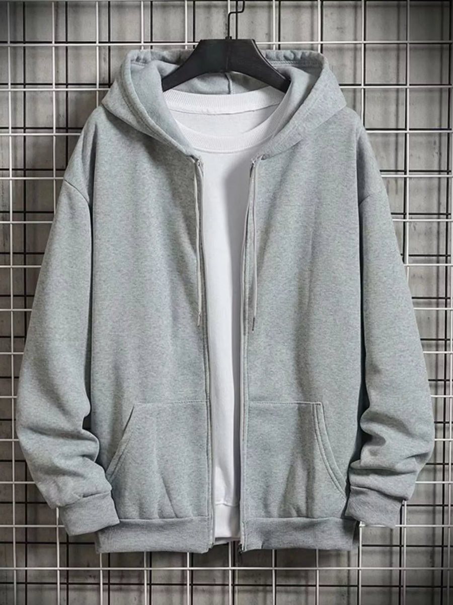 Gray zip-up hoodie with drawstring hood and front pockets, layered over a white t-shirt.