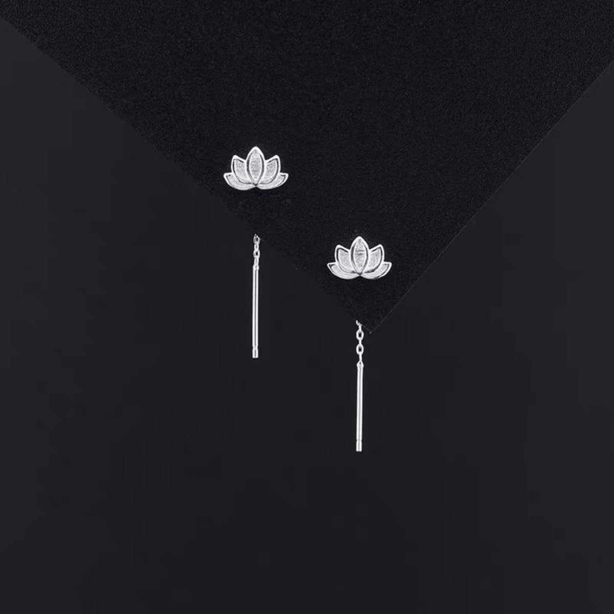 Silver earrings featuring dangle and floral