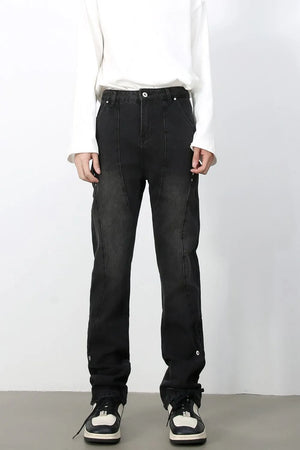 Dark wash denim trousers with asymmetric seams and button details