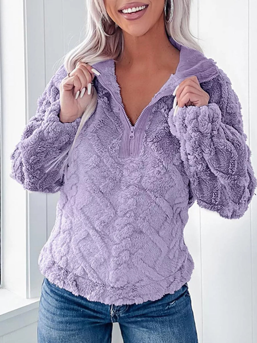 Purple textured fleece quarter zip sweatshirt with a relaxed fit and cozy feel.