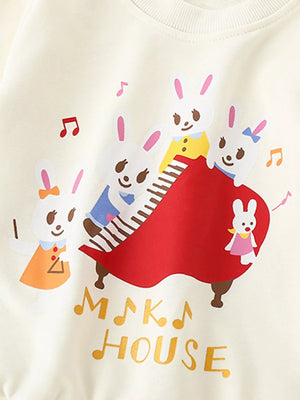 Ivory cotton sweatshirt with cute rabbits playing a piano and singing, with musical notes and text.