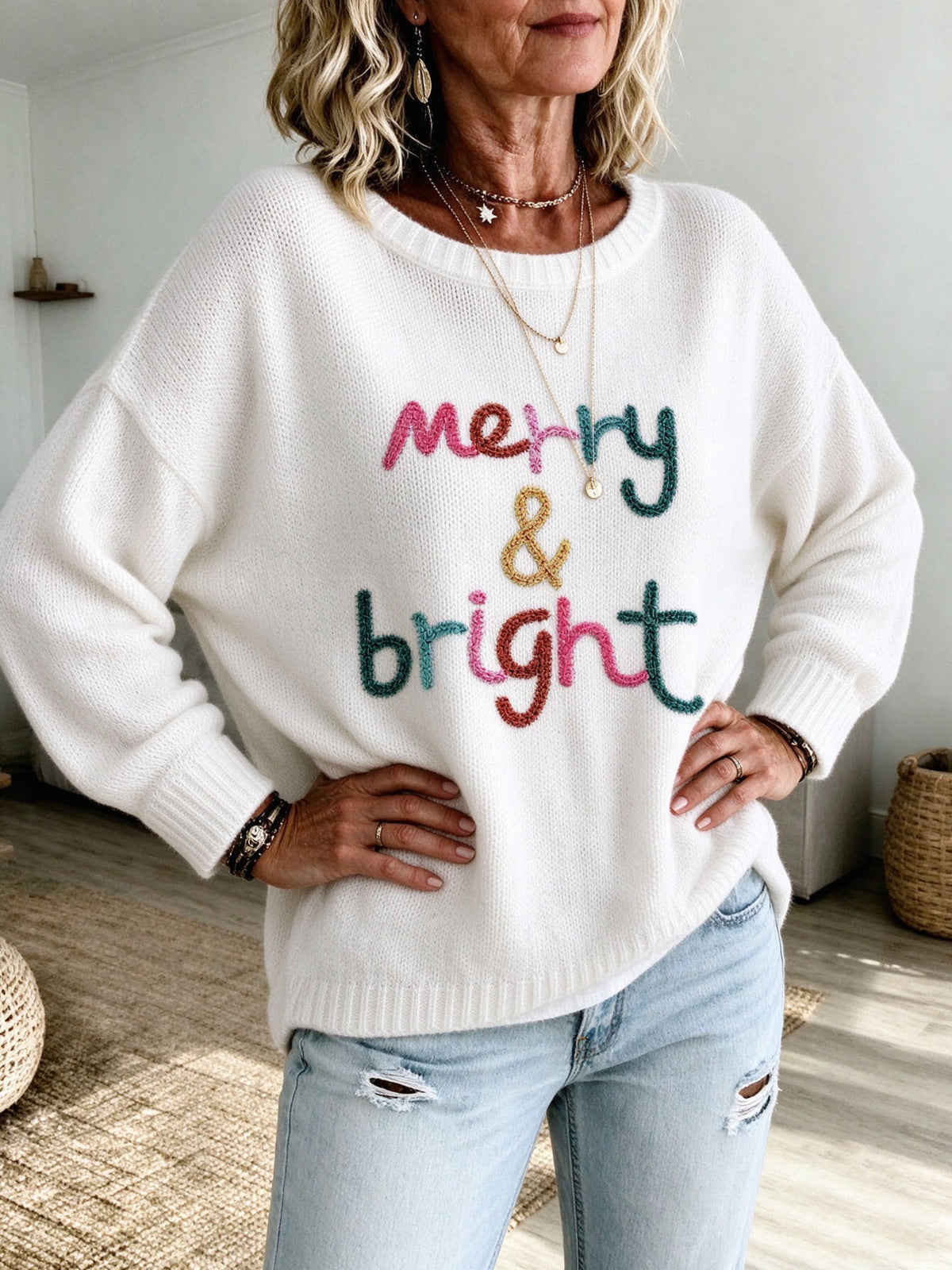 pullover sweater in ivory featuring dropped shoulder and relaxed fit