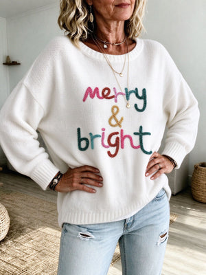 pullover sweater in ivory featuring dropped shoulder and relaxed fit