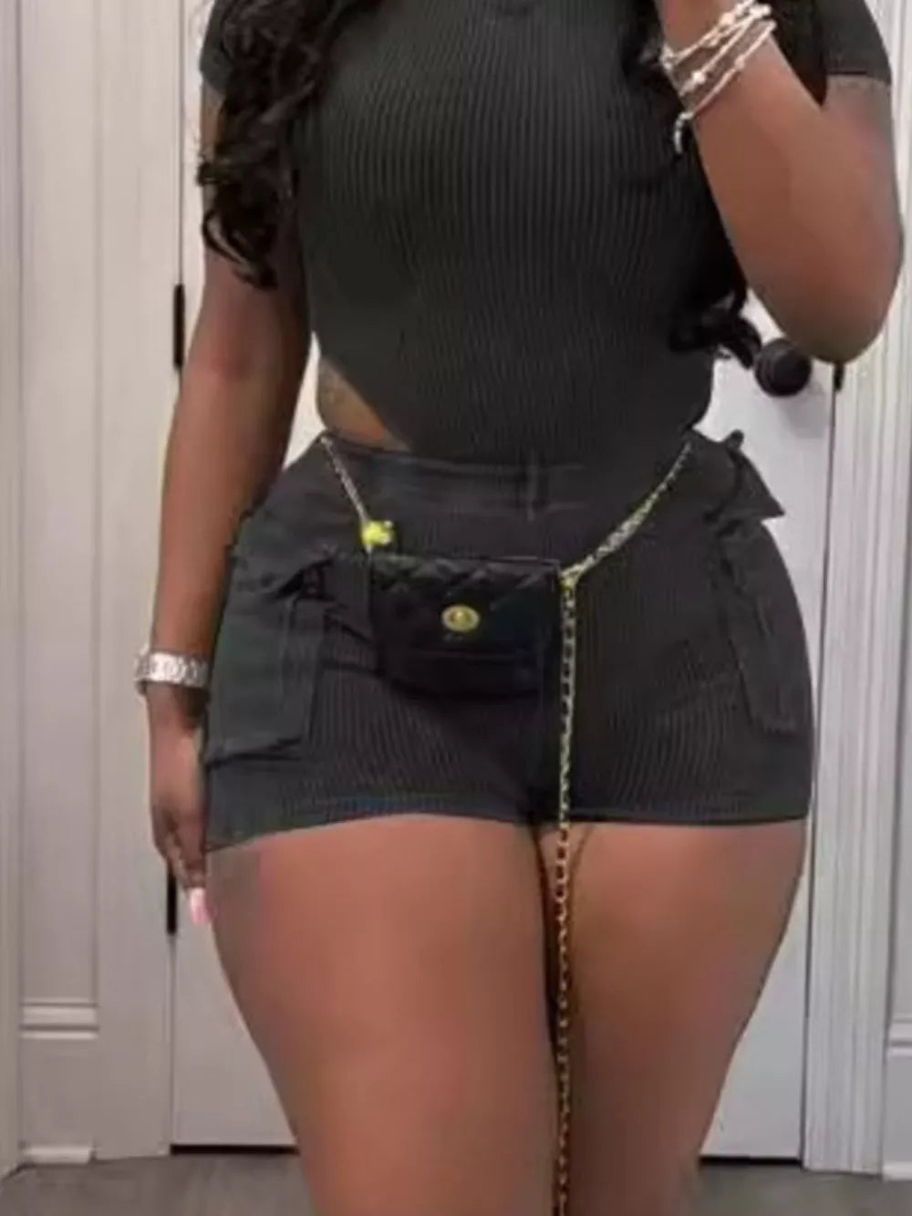 Black ribbed crop top and shorts set with pockets and chain belt detail