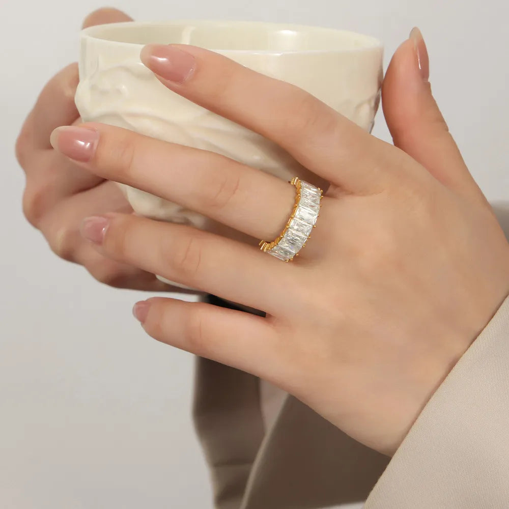 Gold baguette eternity band ring with clear stones