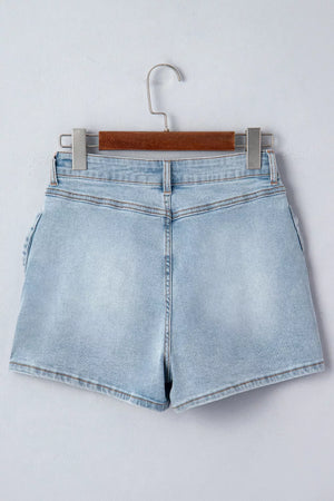 Light wash denim shorts with button fly and bow detail on the side.