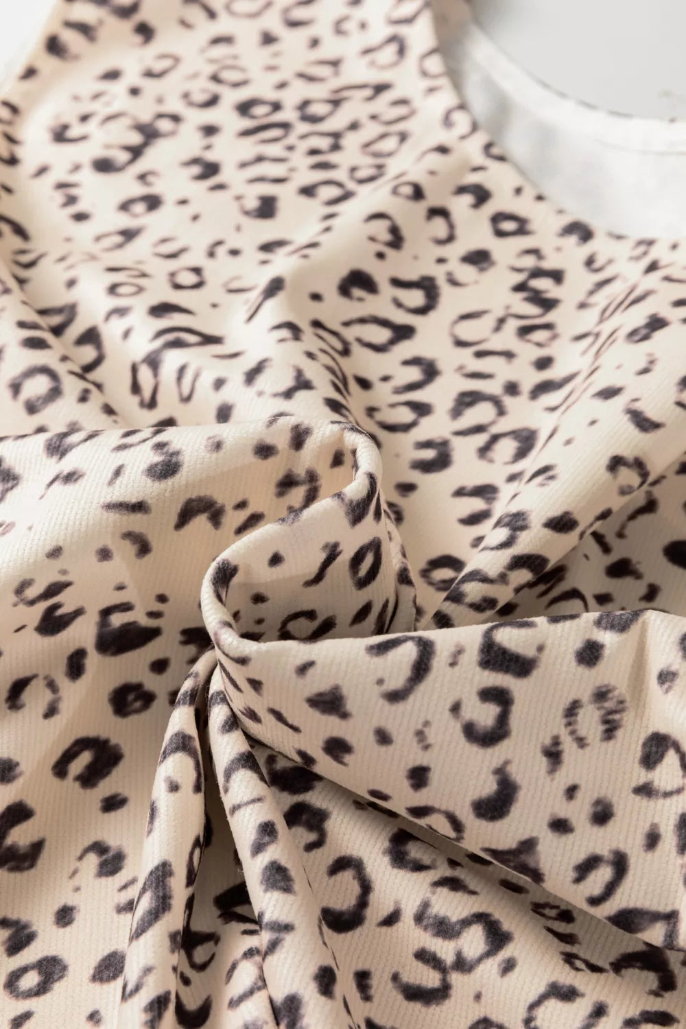 Knot detail leopard print tank top in cream and black.