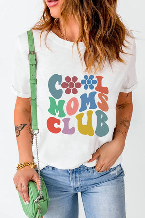 White graphic t-shirt with colorful "Cool Moms Club" text and flower details.