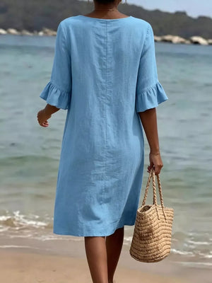 Sky blue casual dress with ruffled sleeves and button detail, knee-length.