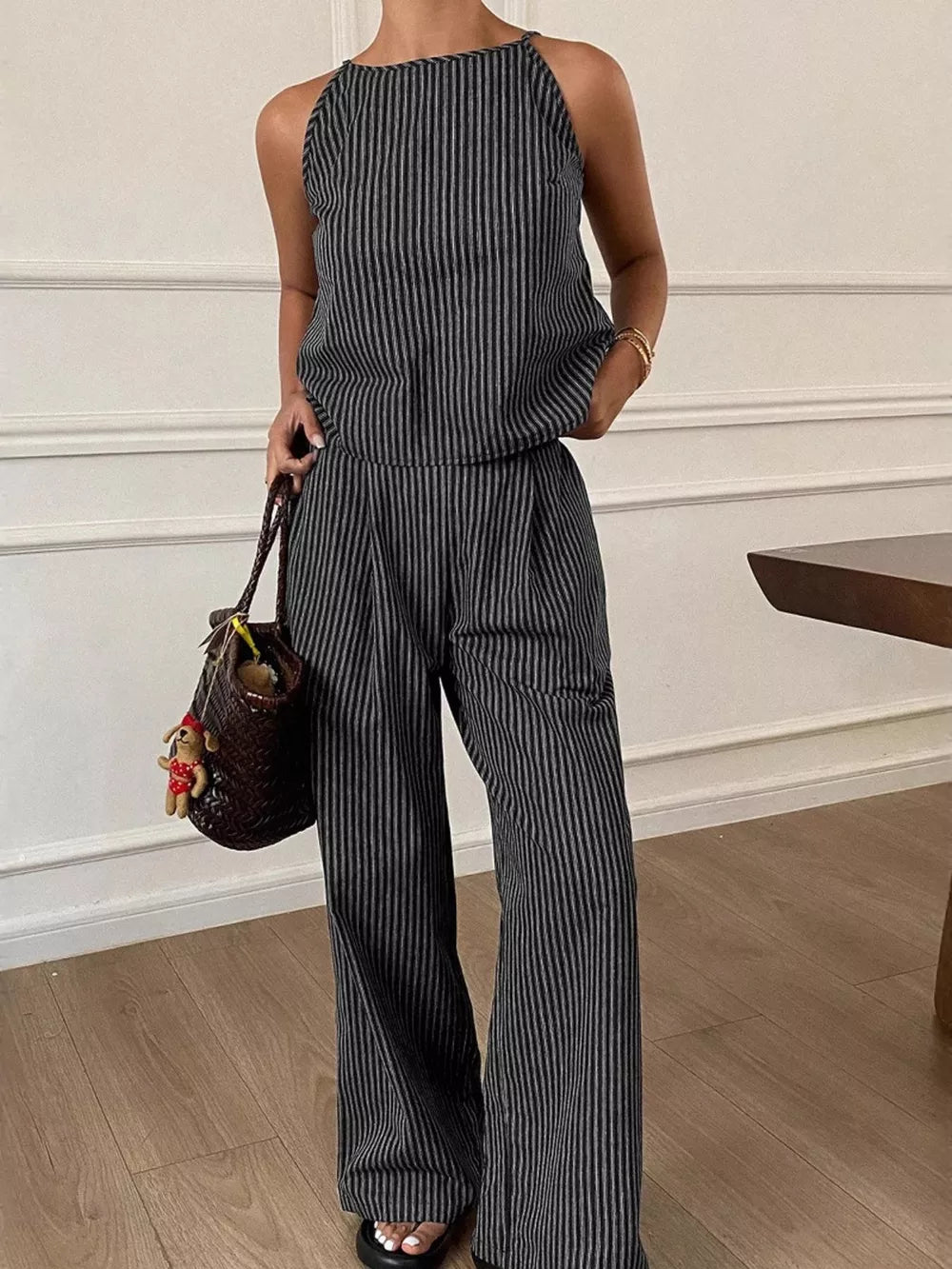 Black striped sleeveless top and wide-leg pants set