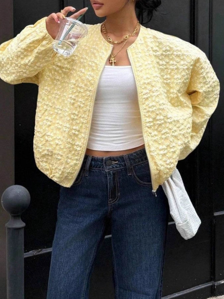 Yellow textured floral embossed zip bomber jacket with a collarless neckline.