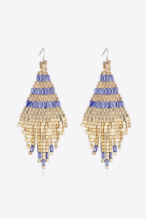 Geometric beaded fringe earrings in gold with dark blue accents, dangling style.
