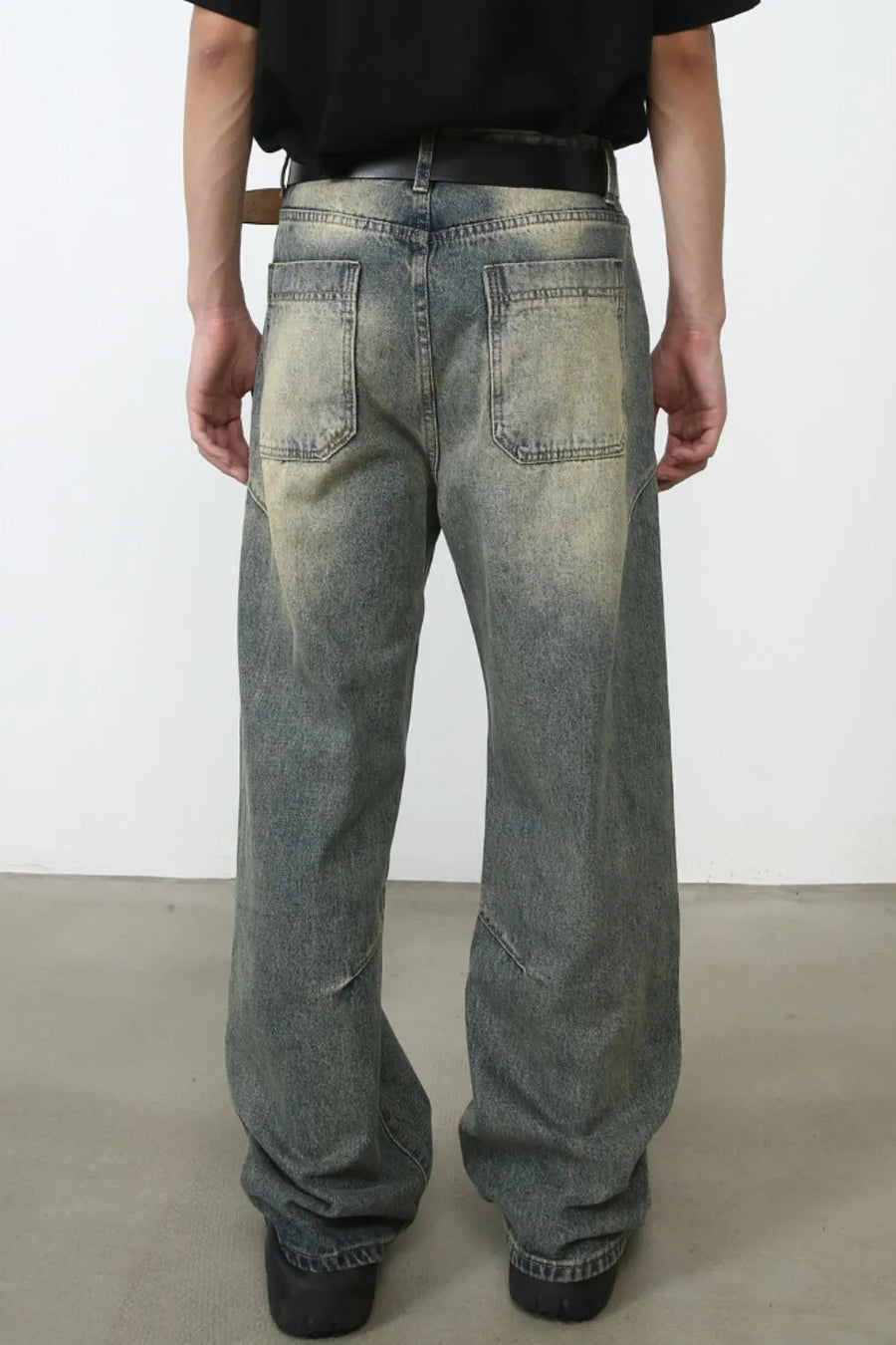 Faded wash baggy carpenter jeans in medium, featuring a distressed look and relaxed fit.
