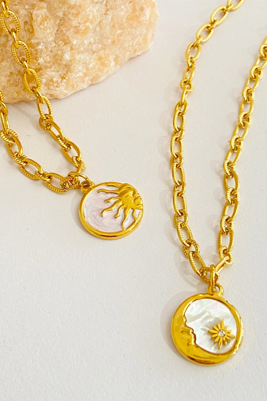 18K gold-plated chain necklaces with celestial charms: sun and moon with star detail.
