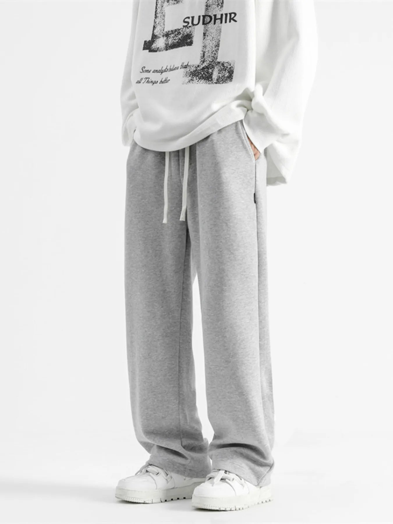Light gray casual loose fit sweatpants with drawstring and pockets.