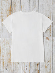 White t-shirt with short sleeves and crew neck, featuring iridescent heart and cross appliqué detail.