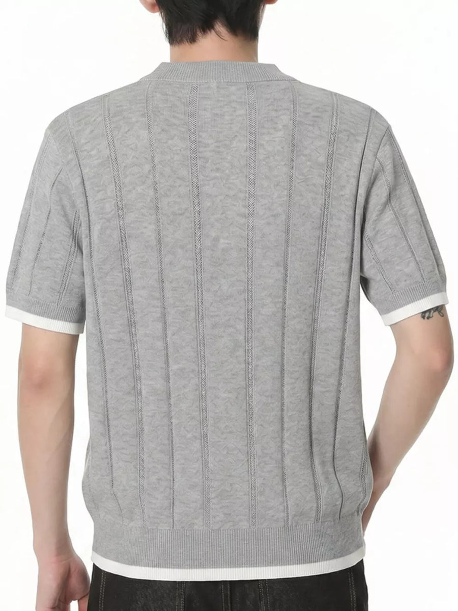 Grey knit t-shirt with contrast white accents on sleeves and hem, featuring vertical ribbed texture.