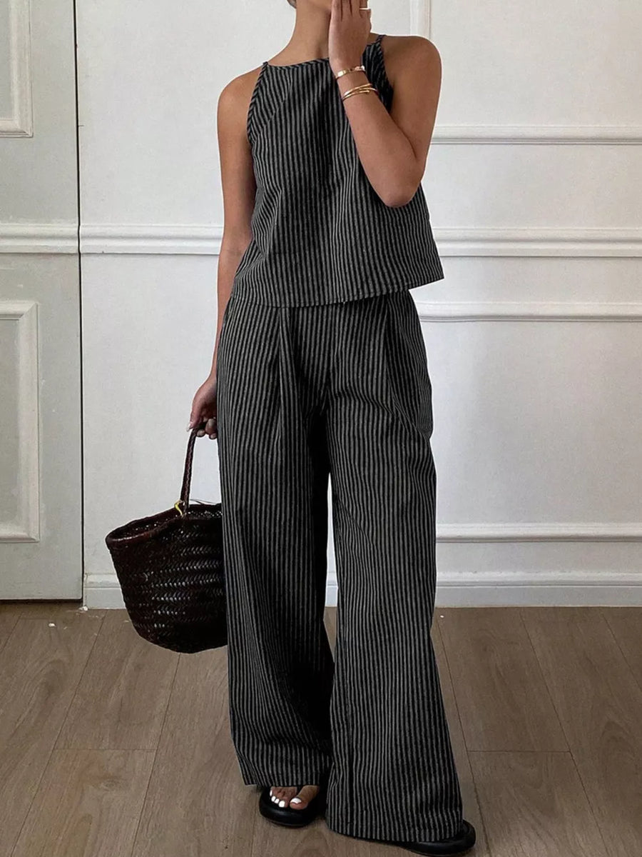 Black striped sleeveless top and wide-leg pants set with a halter neckline.