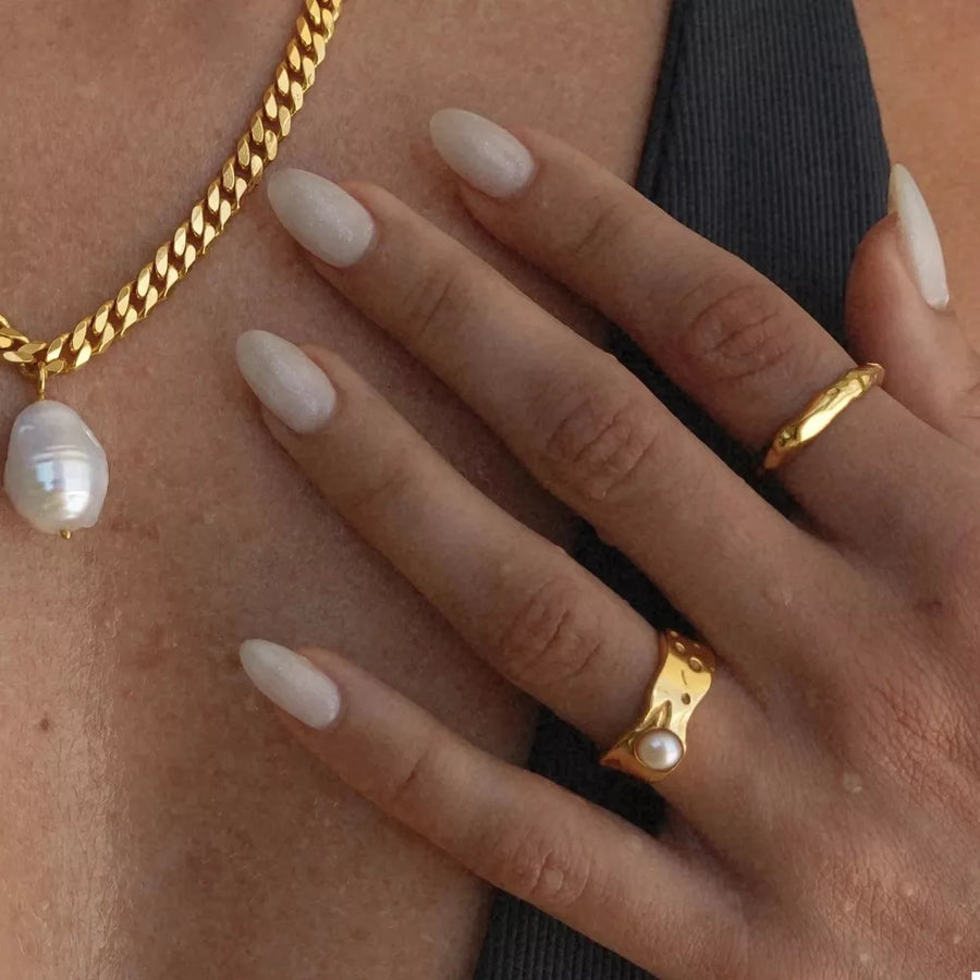 gold ring with synthetic pearl accent and none