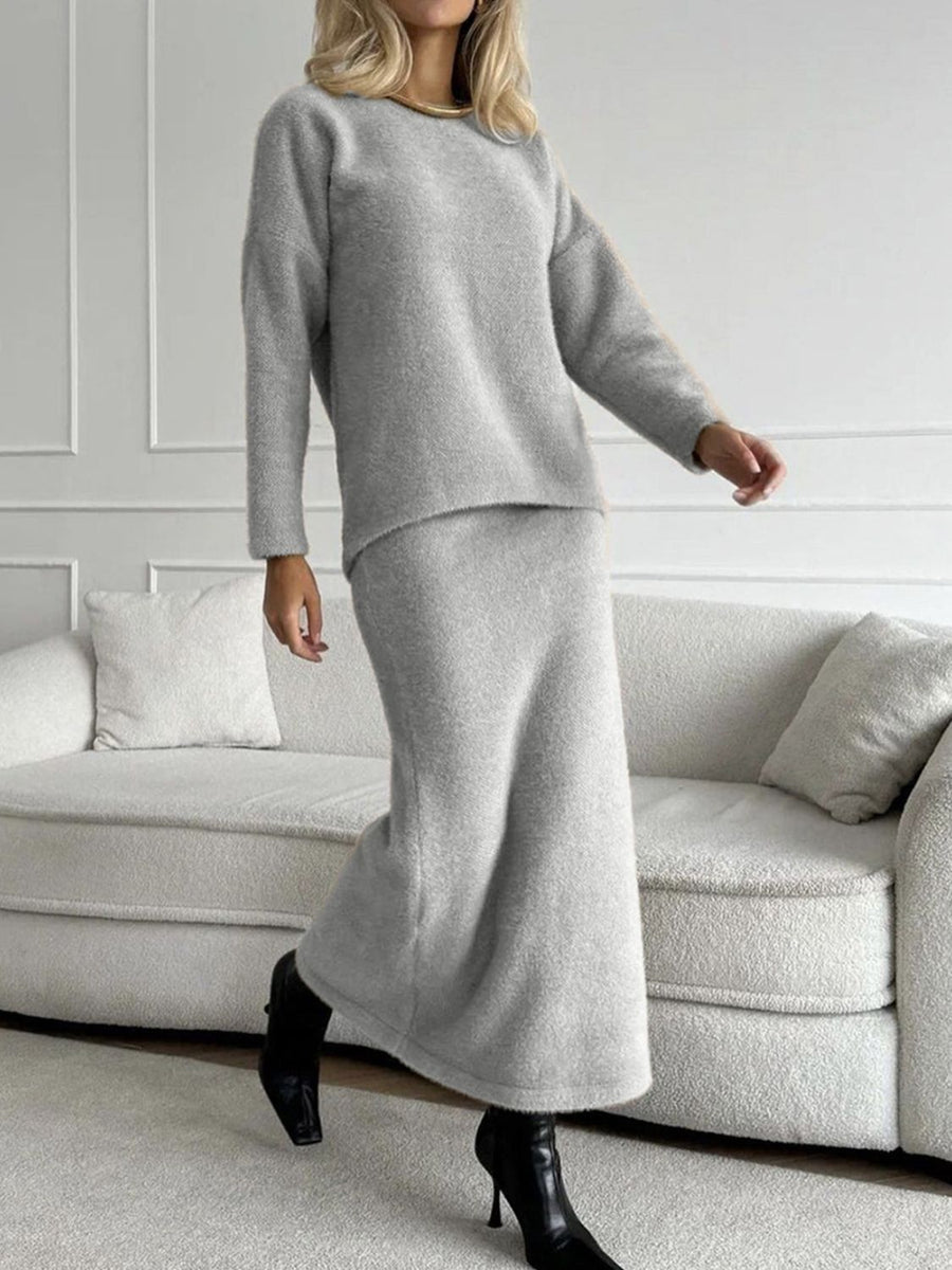 Gray textured knit co-ord set with relaxed fit sweater and midi skirt.