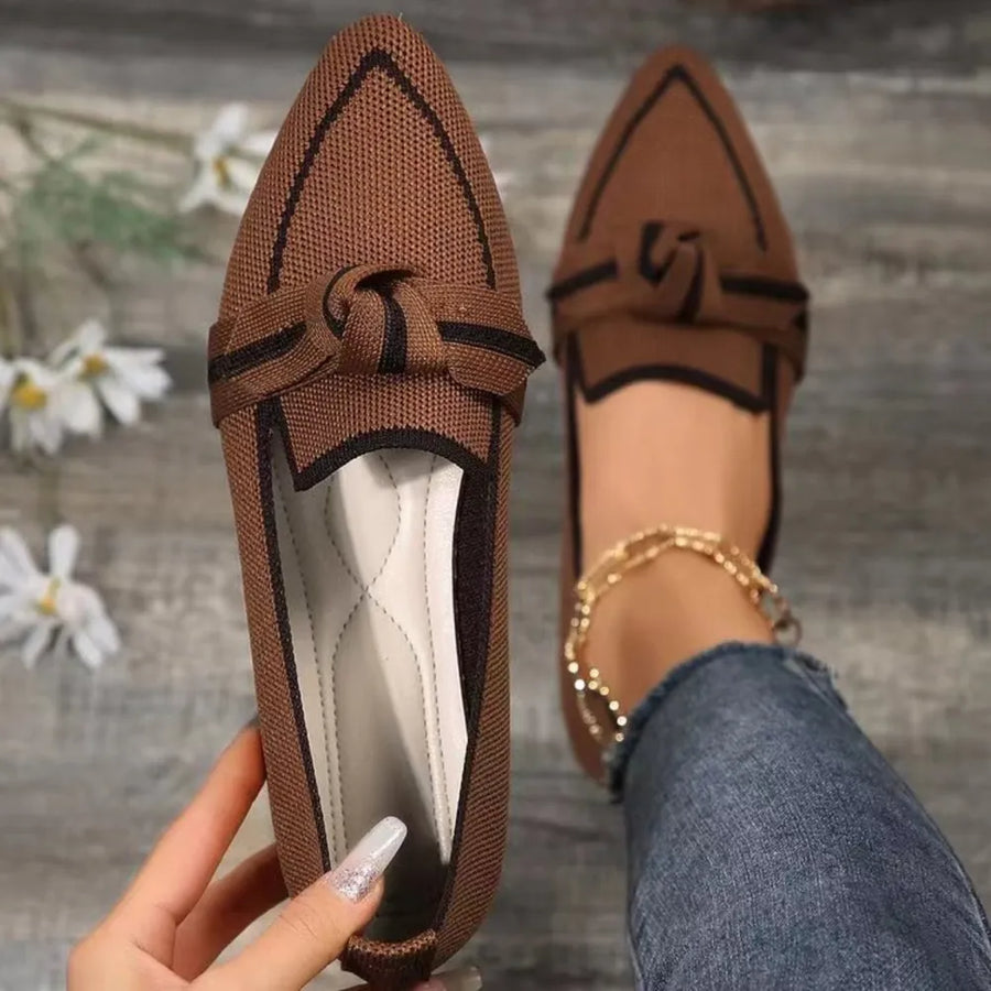 Brown knit bow loafers with contrast trim and pointed toe.