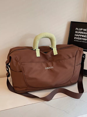 Brown Oxford cloth duffel bag with padded handles and shoulder strap