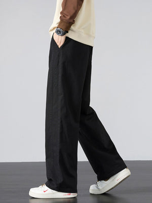 Men's Plus Size Pocketed Drawstring Wide Leg Pants in olive green with drawstring waist
