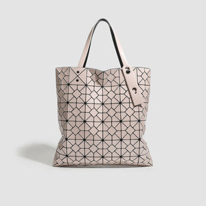handbag in blush pink featuring geometric paneling and boxy fit