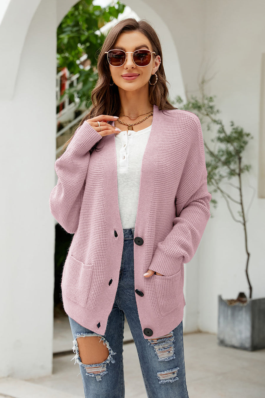 Waffle knit oversized cardigan in carnation pink with button front and pockets.