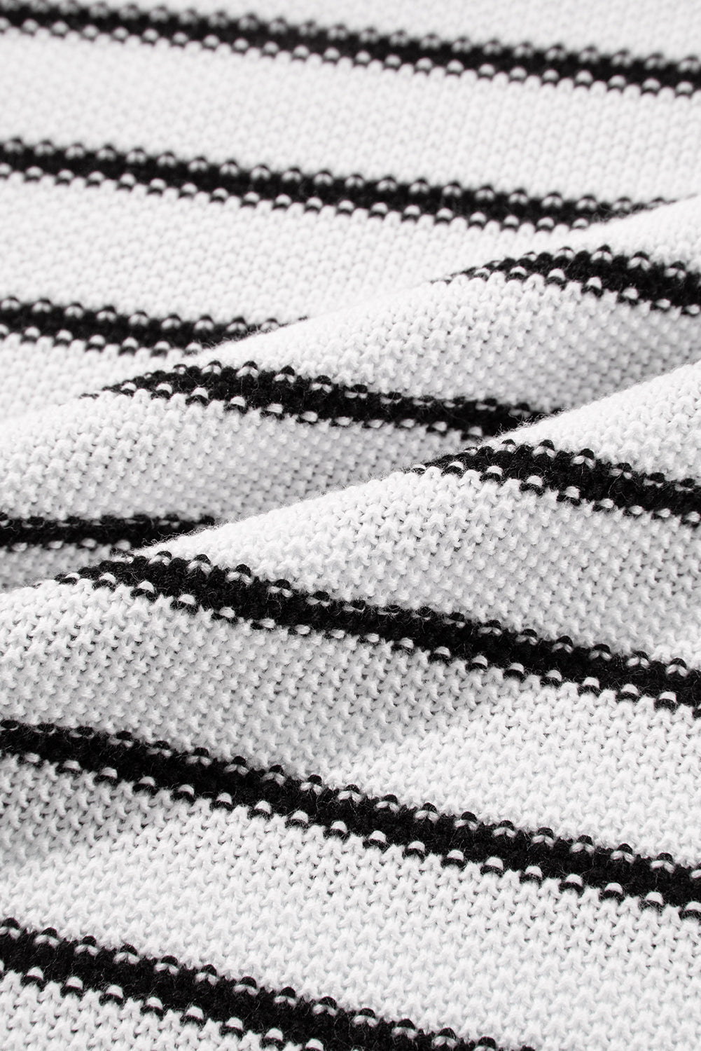 Black and cream striped acrylic knit sweater with contrast trim detail.