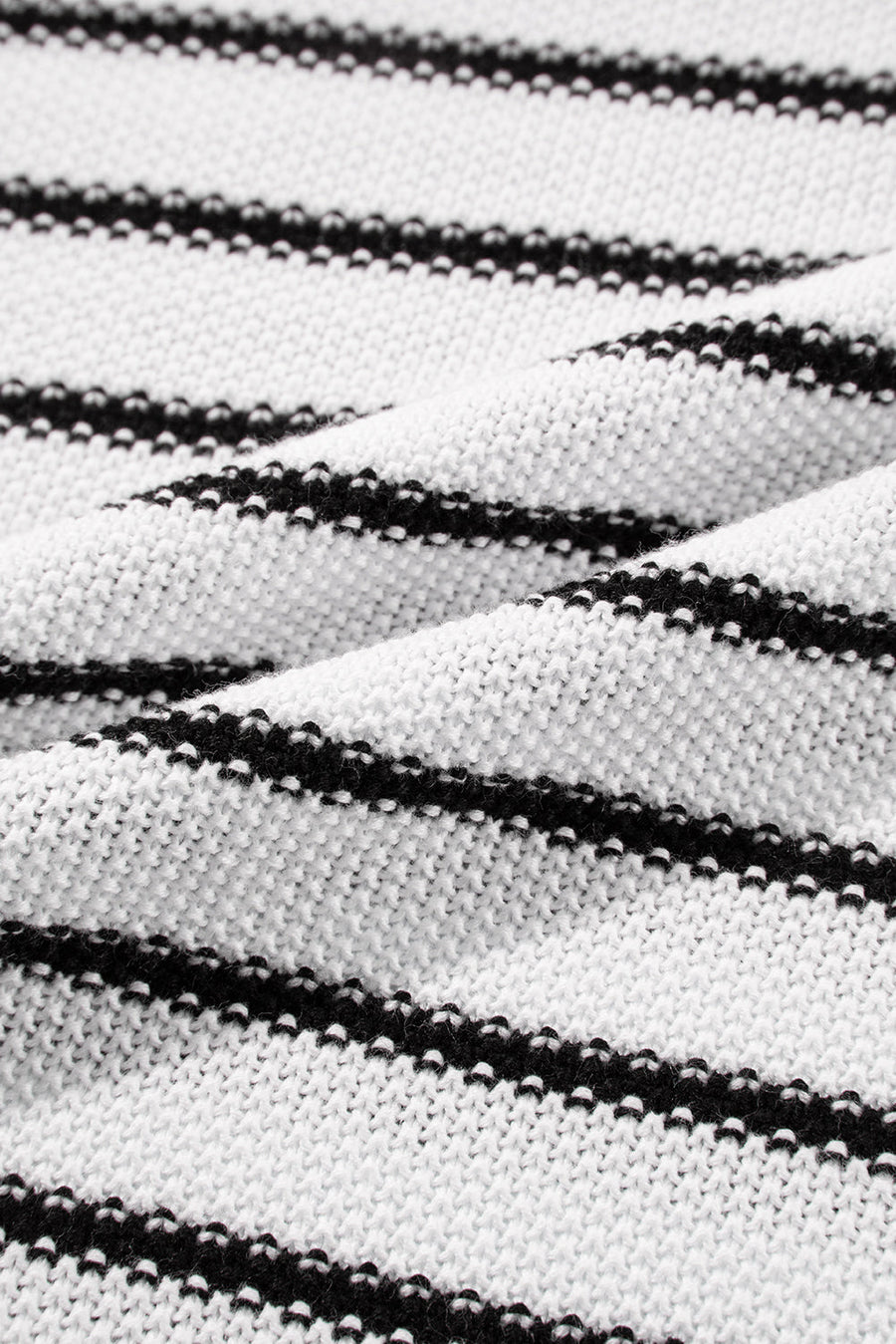 Black and cream striped acrylic knit sweater with contrast trim detail.