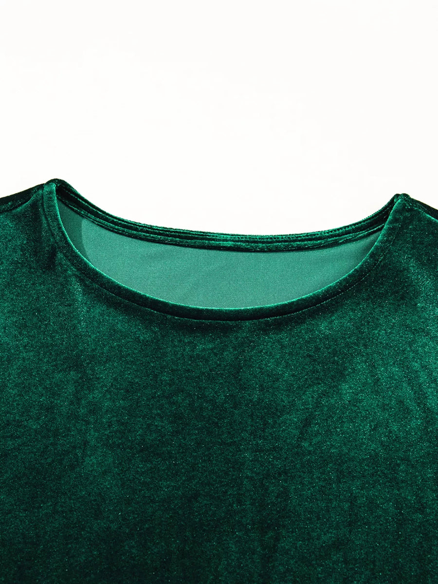Dark green velvet mini dress with round neckline and short puff sleeves.