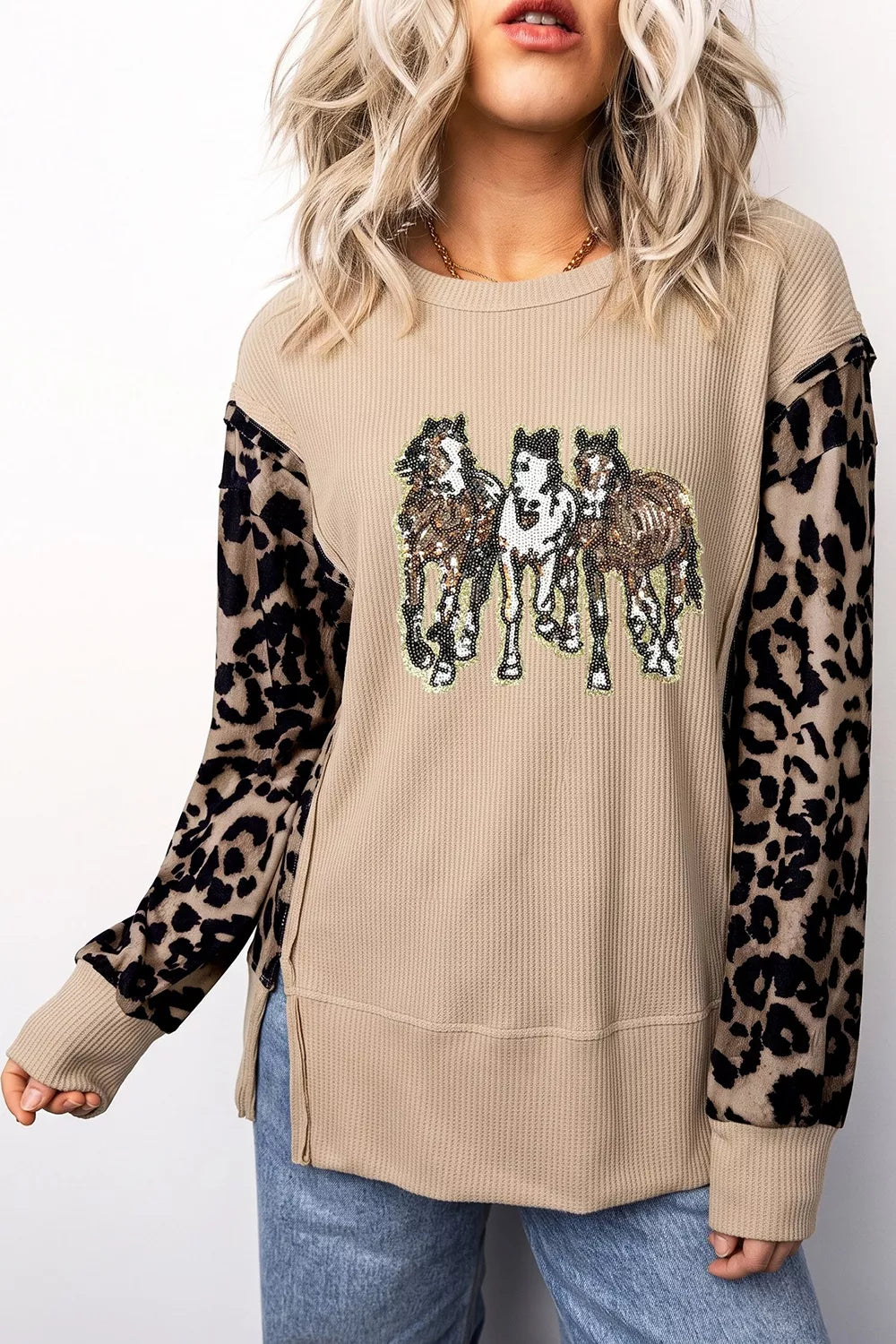 black tunic featuring exposed seam and leopard