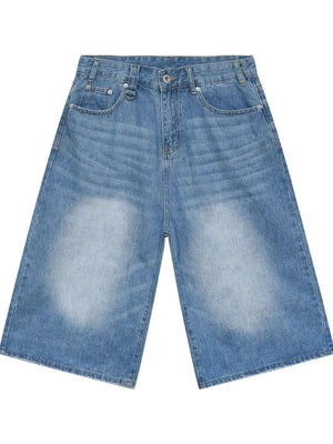 Light blue denim culottes with distressed detailing and wide legs.