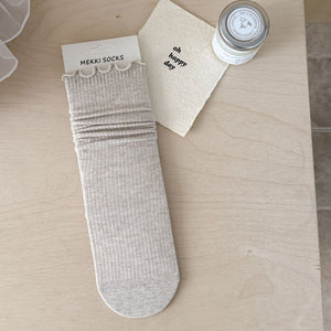 socks in light beige featuring ribbed knit and fitted fit