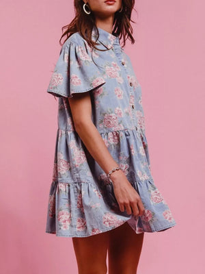 Light blue floral denim mini dress with ruffled tiers and flutter sleeves.