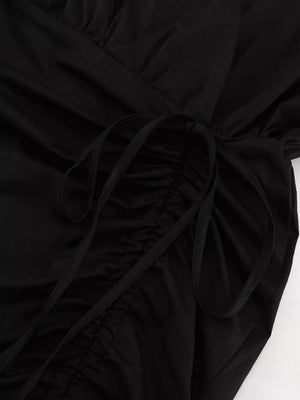 Black ruched mini dress with adjustable drawstring detail