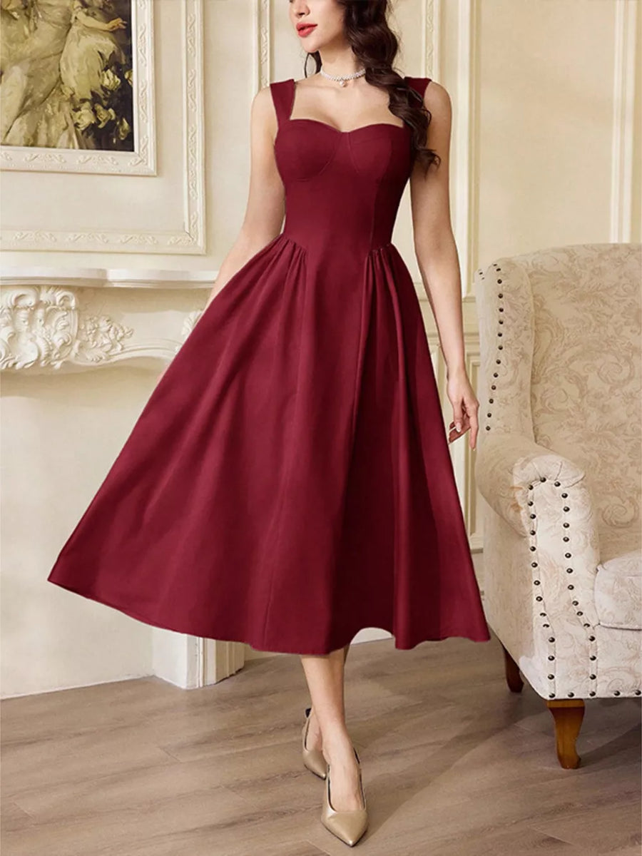 Burgundy midi dress with sweetheart neckline and a-line skirt, sleeveless with wide straps.