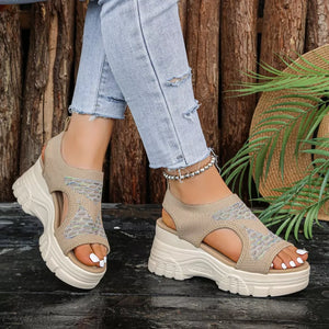 Khaki open-toe platform sandals with geometric pattern knit upper and chunky sole.