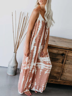 Maxi dress with spaghetti straps and a tie-dye pattern in rust and white.